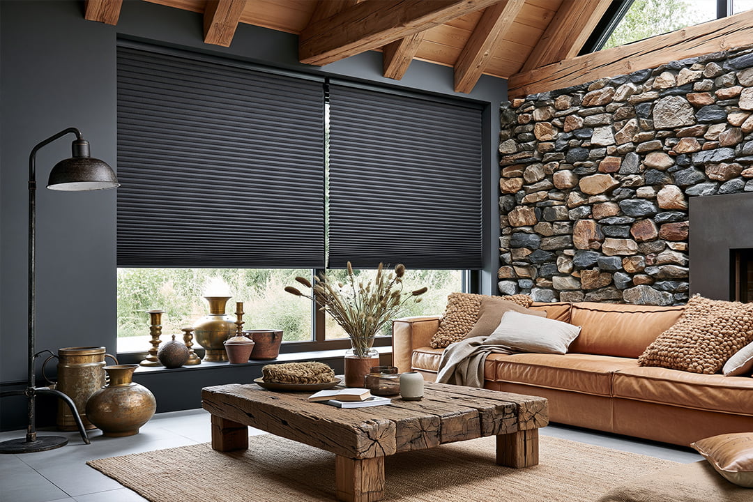 Blockout honeycomb blinds fitted in a rustic lounge