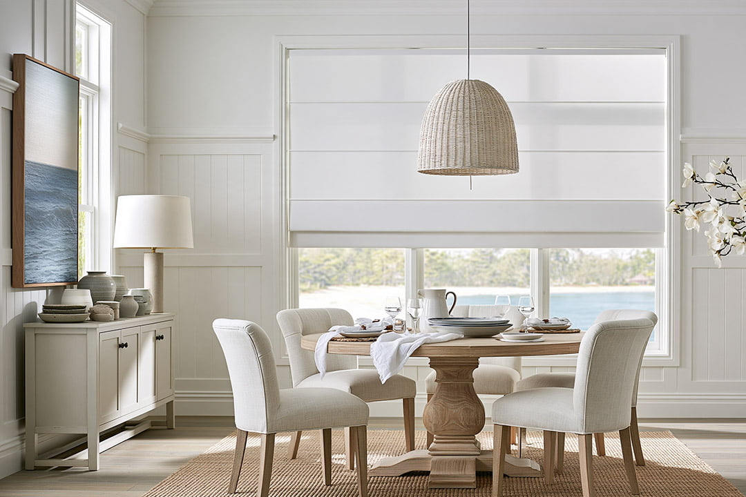 White roman blinds fitted in a Hamptons-style dining room