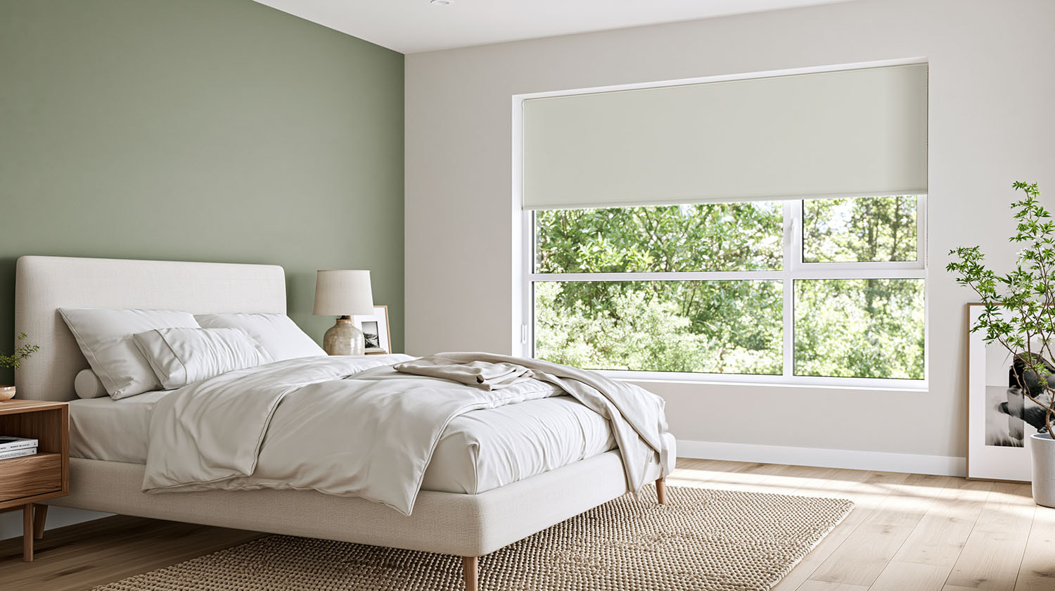 Blockout roller blind in a sage green bedroom