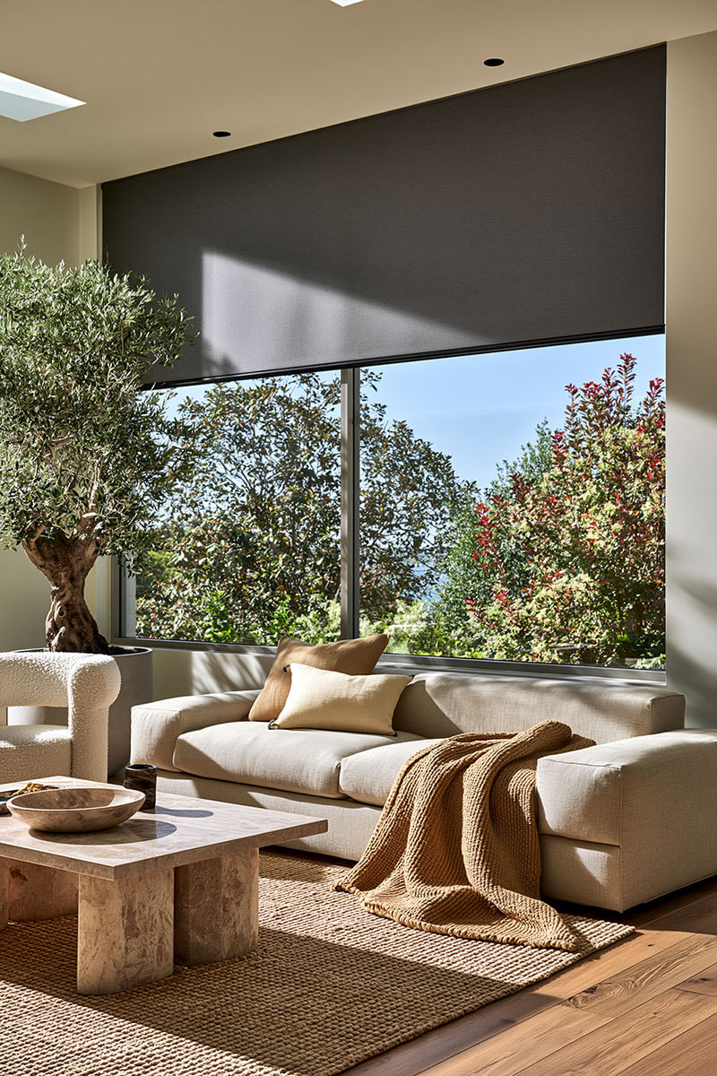 Blockout roller blind in a sunlit living room